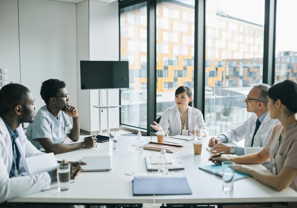 Group of Medics at Meeting Table